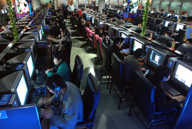 Chinese use computers at Internet cafe in Nanjing